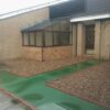 Green QuartzGrip solid top panels used to cover a trench within a residential complex