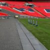 A long GRP olid top trench cover running around the edge of the pitch at Wembley Stadium