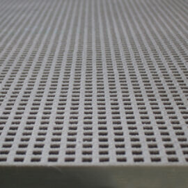 A close-up of a panel of QuartzGrip GRP Mini Mesh Grating in grey showing the slip-resistant, gritted finish